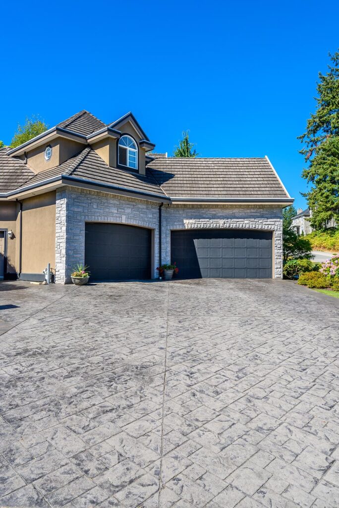 Finished residential driveway concrete work in Birmingham by 4 Way Cement.